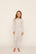 Model is wearing Kids Printed TENCEL™ Modal Unisex Long PJ Set in On The Slopes Ivory/Navy