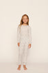 Model is wearing Kids Printed TENCEL™ Modal Unisex Long PJ Set in On The Slopes Ivory/Navy