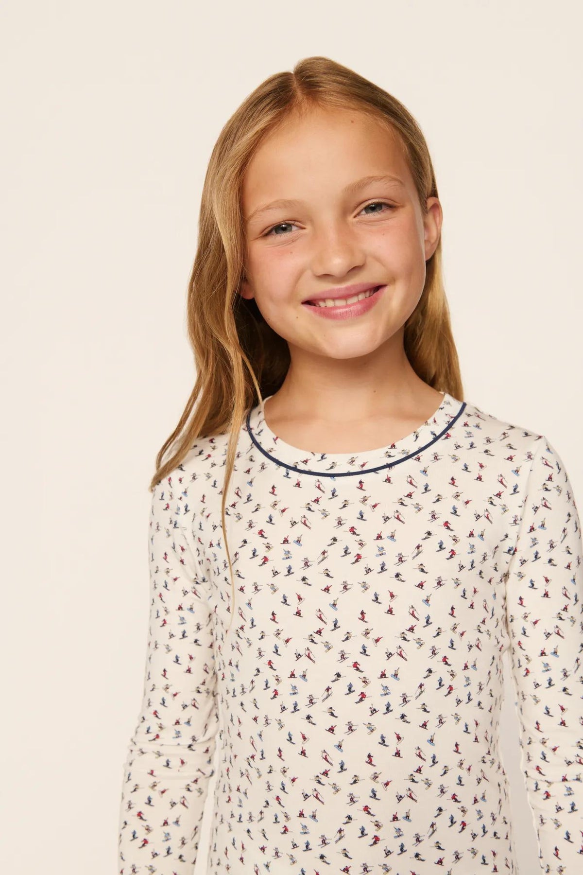 Model is wearing Kids Printed TENCEL™ Modal Unisex Long PJ Set in On The Slopes Ivory/Navy