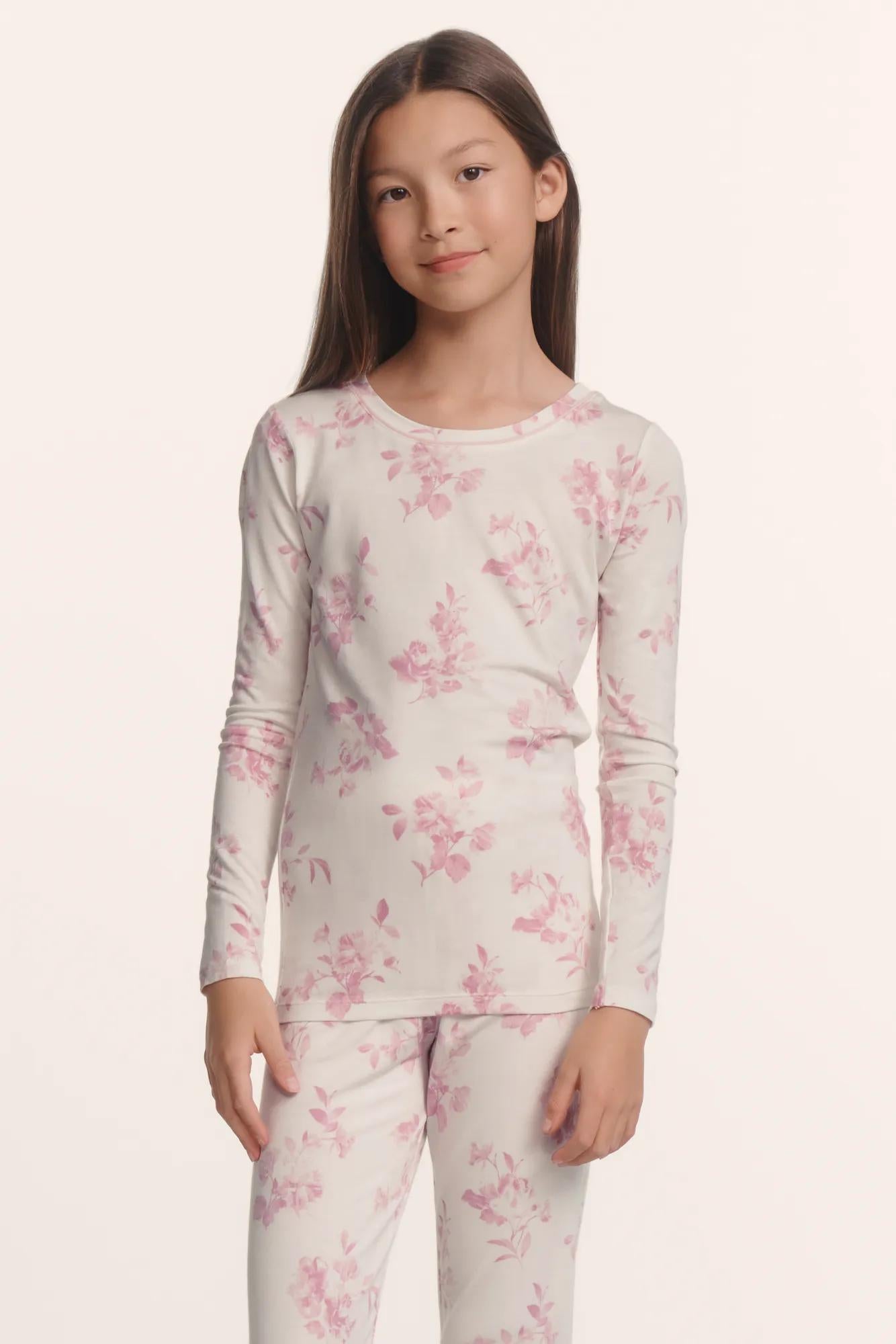 Model is wearing Kids Printed TENCEL™ Modal Unisex Long PJ Set in Rose Garden Cameo Pink/Pale Pi