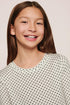 Model is wearing Kids Printed TENCEL™ Modal Unisex Long PJ Set in Tide Dot Ivory/Ivory