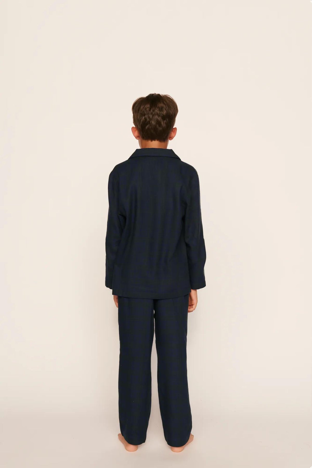 Model is wearing Kid's Flannel Long PJ Set in Heritage Check Navy/Navy