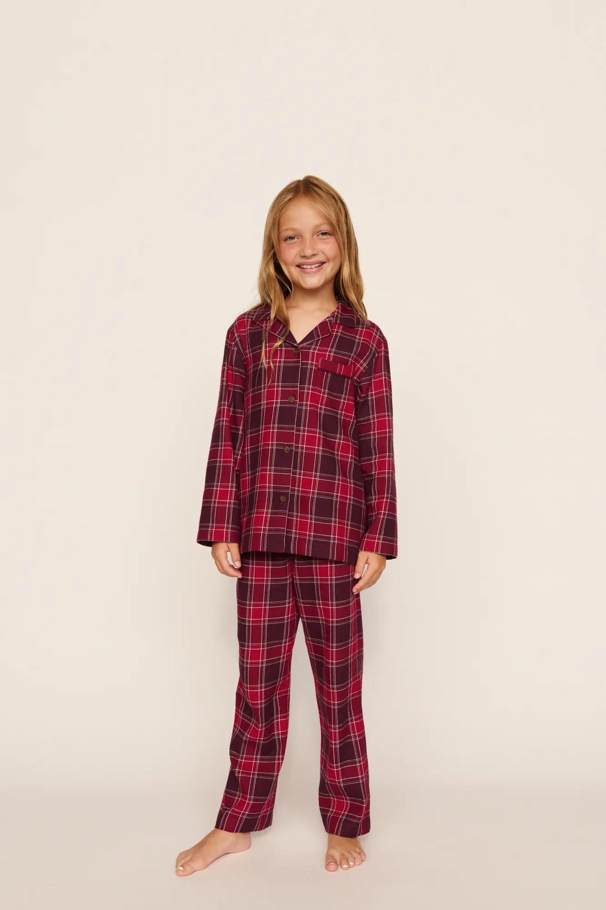 Model is wearing Kid's Flannel Long PJ Set in Oxford Check Holly Red/Wildber