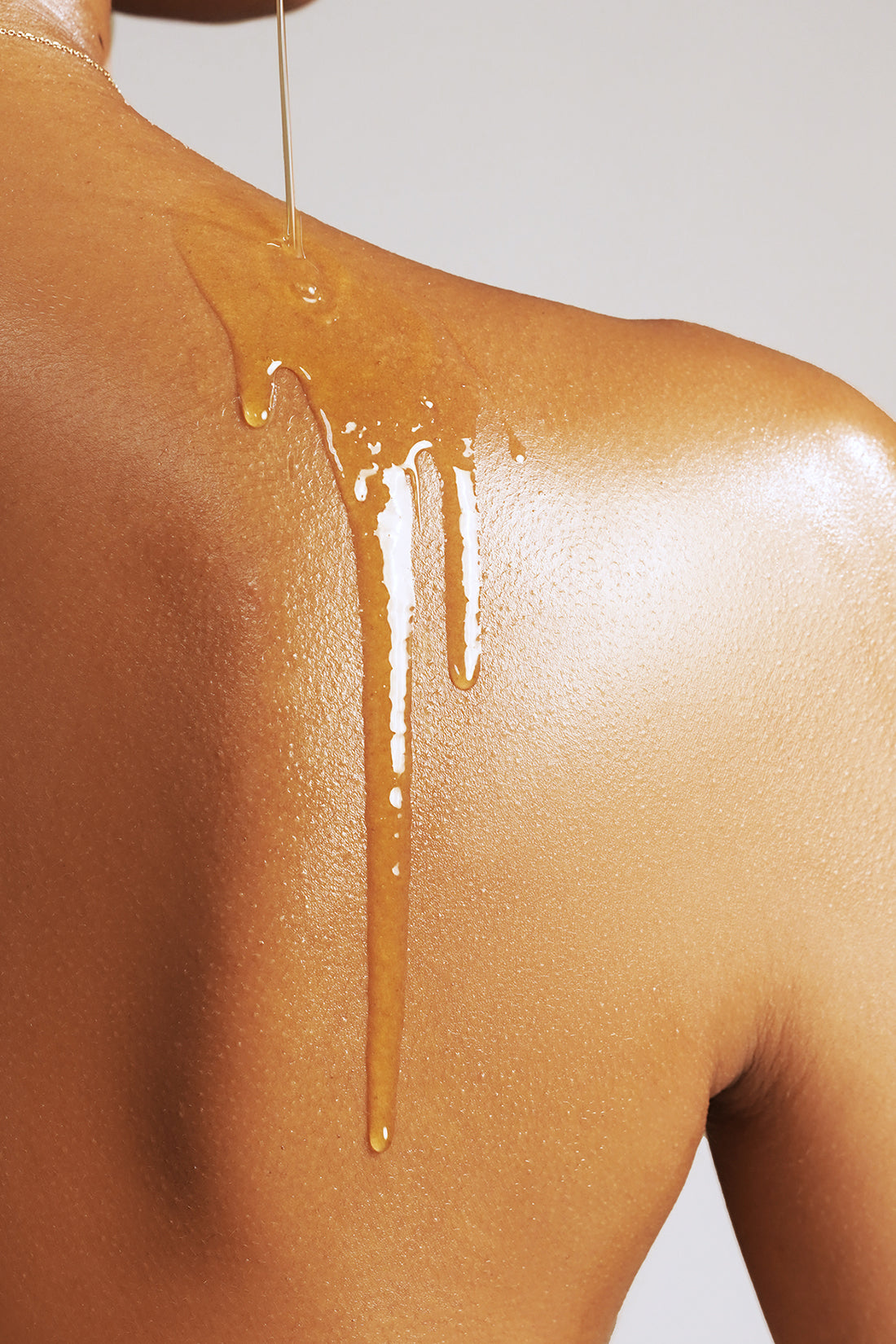 Image of model wearing True Botanical Body Oil