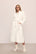 Model is wearing renew plush robe in Ivory