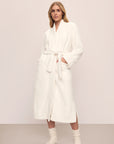 Model is wearing renew plush robe in Ivory