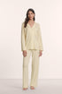 Model is wearing Gisele TENCEL™ Modal Long PJ Set in Buttercream/Ivory