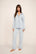 Model is wearing Gisele TENCEL™ Modal Long PJ Set in Cloud Blue/Navy