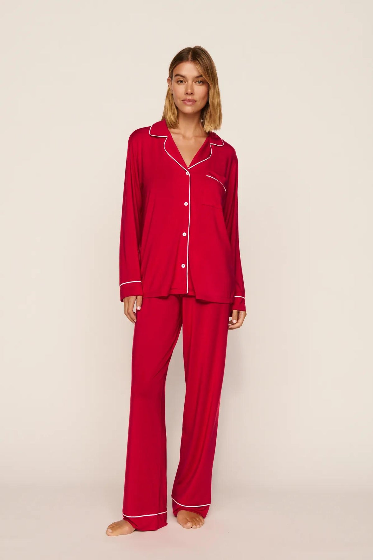Model is wearing Gisele TENCEL™ Modal Long PJ Set in Holly Red/Ivory