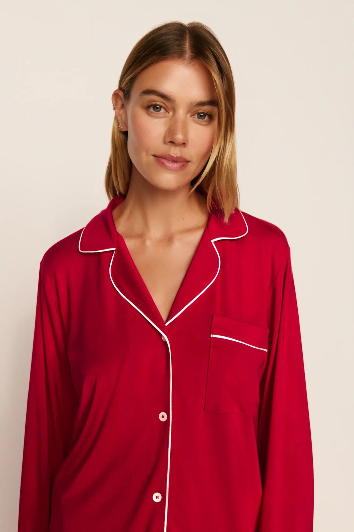 Model is wearing Gisele TENCEL™ Modal Long PJ Set in Holly Red/Ivory