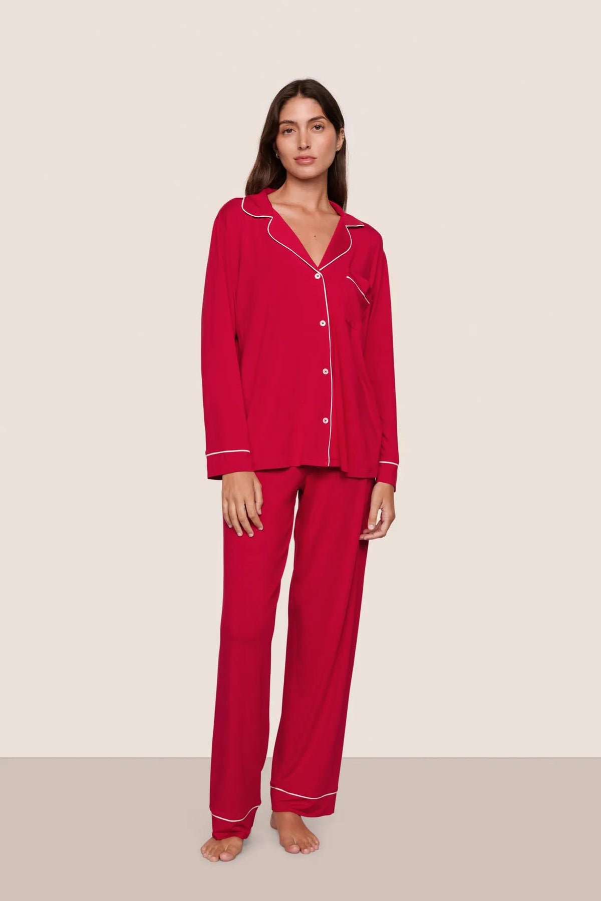 Model is wearing Gisele TENCEL™ Modal Long PJ Set in Holly Red/Ivory