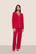 Model is wearing Gisele TENCEL™ Modal Long PJ Set in Holly Red/Ivory