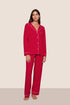 Model is wearing Gisele TENCEL™ Modal Long PJ Set in Holly Red/Ivory