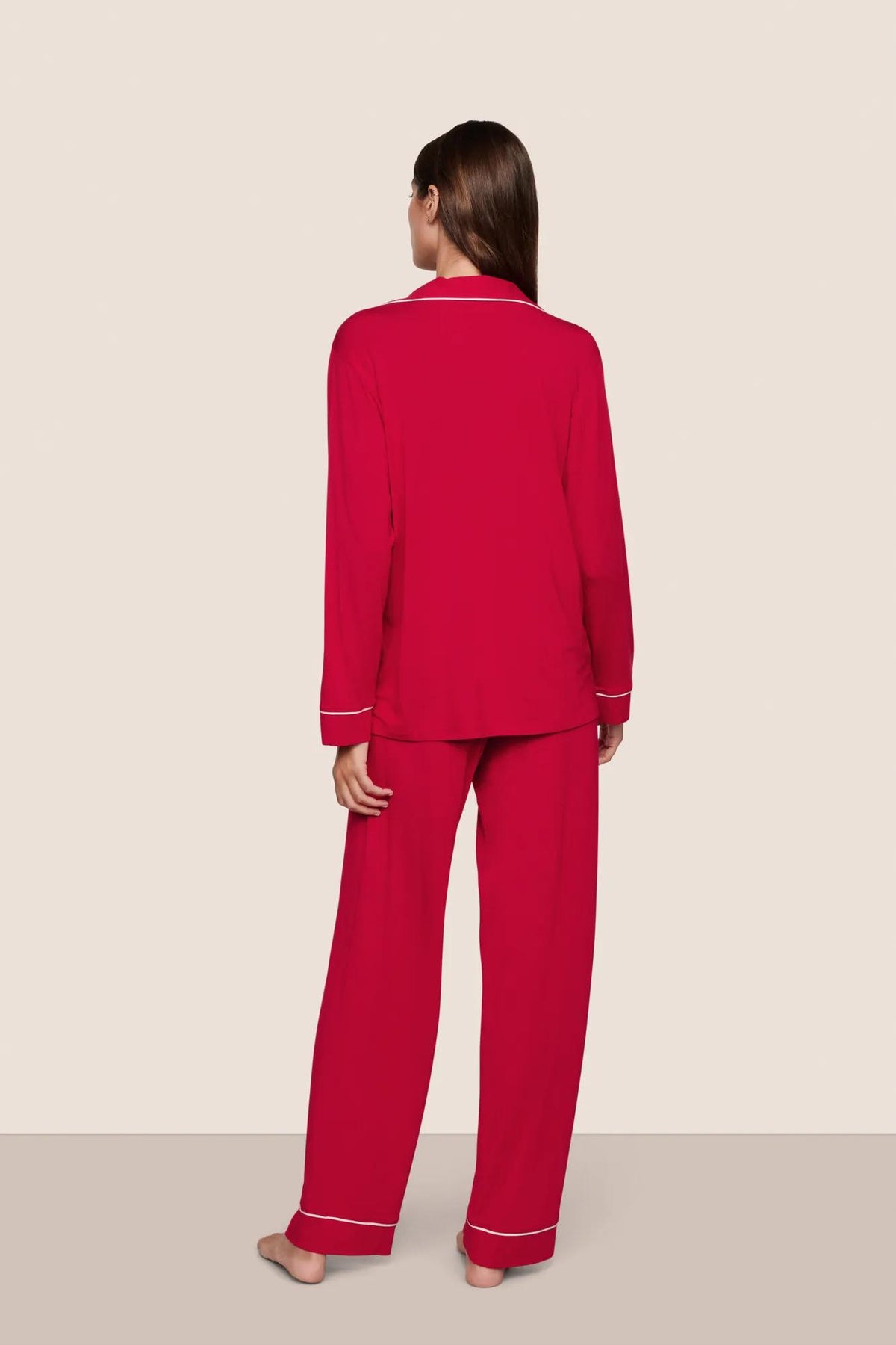 Model is wearing Gisele TENCEL™ Modal Long PJ Set in Holly Red/Ivory