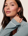 Model is wearing Gisele TENCEL™ Modal Long PJ Set  in Lead/Ivory