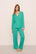 Model is wearing Gisele TENCEL™ Modal Long PJ Set in  Oasis Green/White