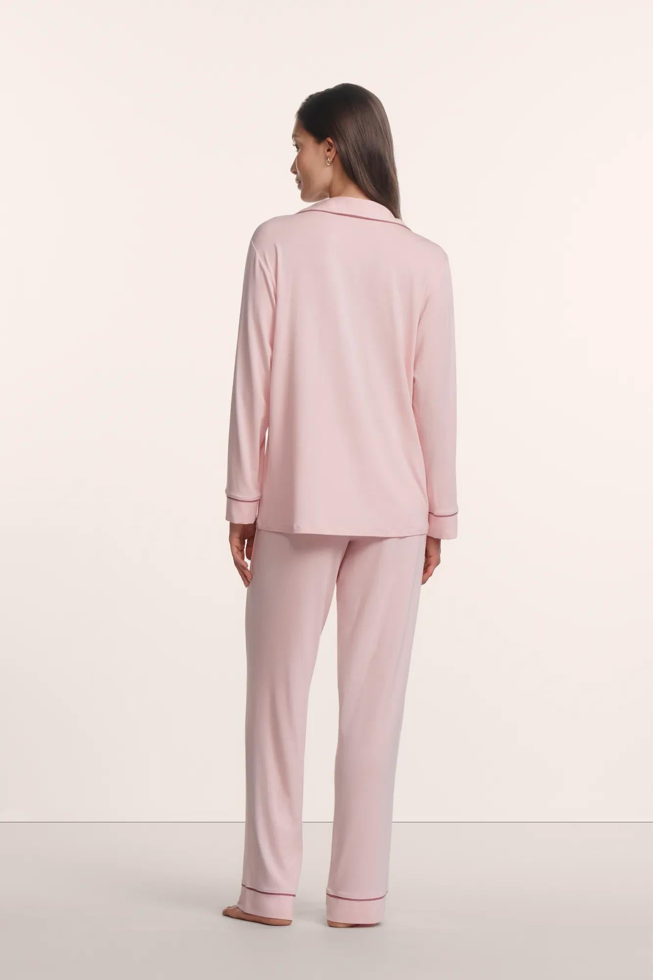 Model is wearing Gisele TENCEL™ Modal Long PJ Set in Pale Pink/Fig