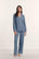 Model is wearing Gisele TENCEL™ Modal Long PJ Set in Slate Blue/Ivory