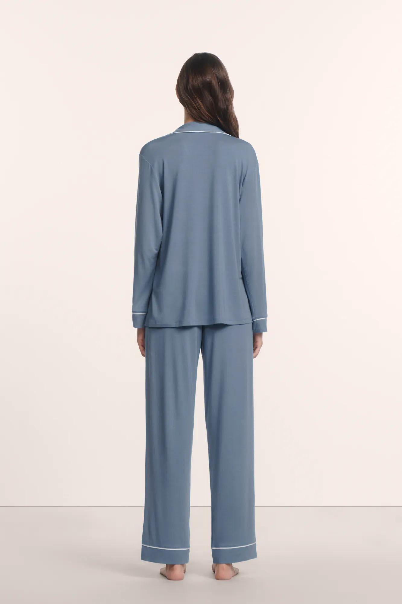 Model is wearing Gisele TENCEL™ Modal Long PJ Set in Slate Blue/Ivory