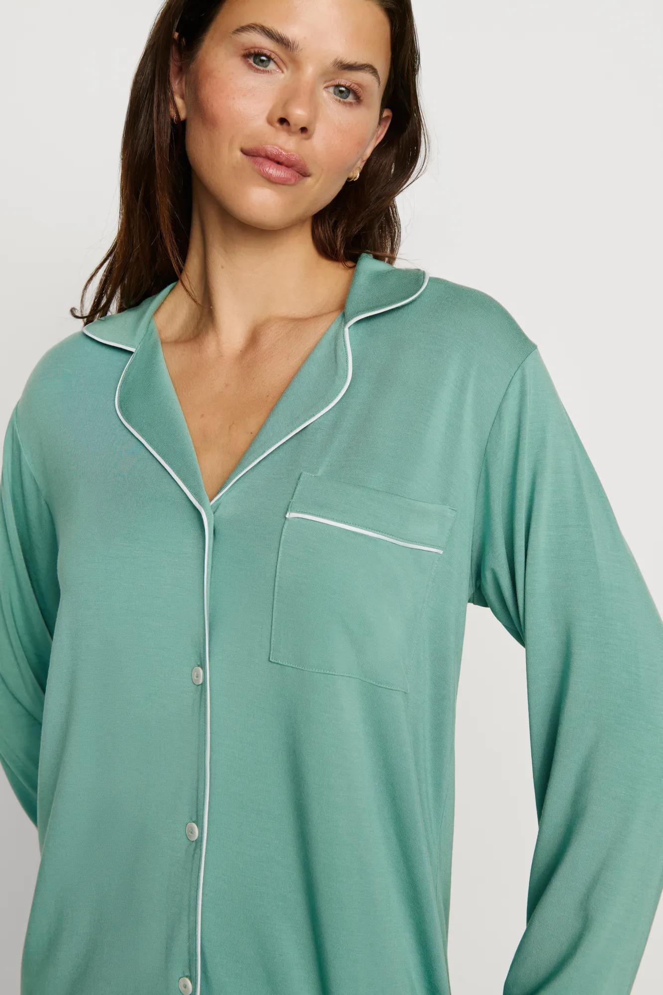 Model is wearing Gisele TENCEL™ Modal Long PJ Set in Seagrass/White