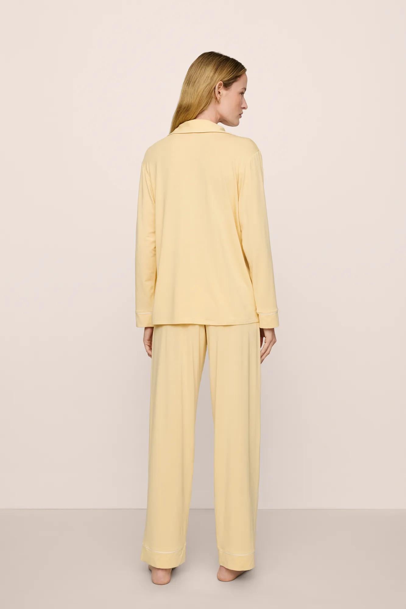 Model is wearing Gisele TENCEL™ Modal Long PJ Set in  Sunrise/Ivory