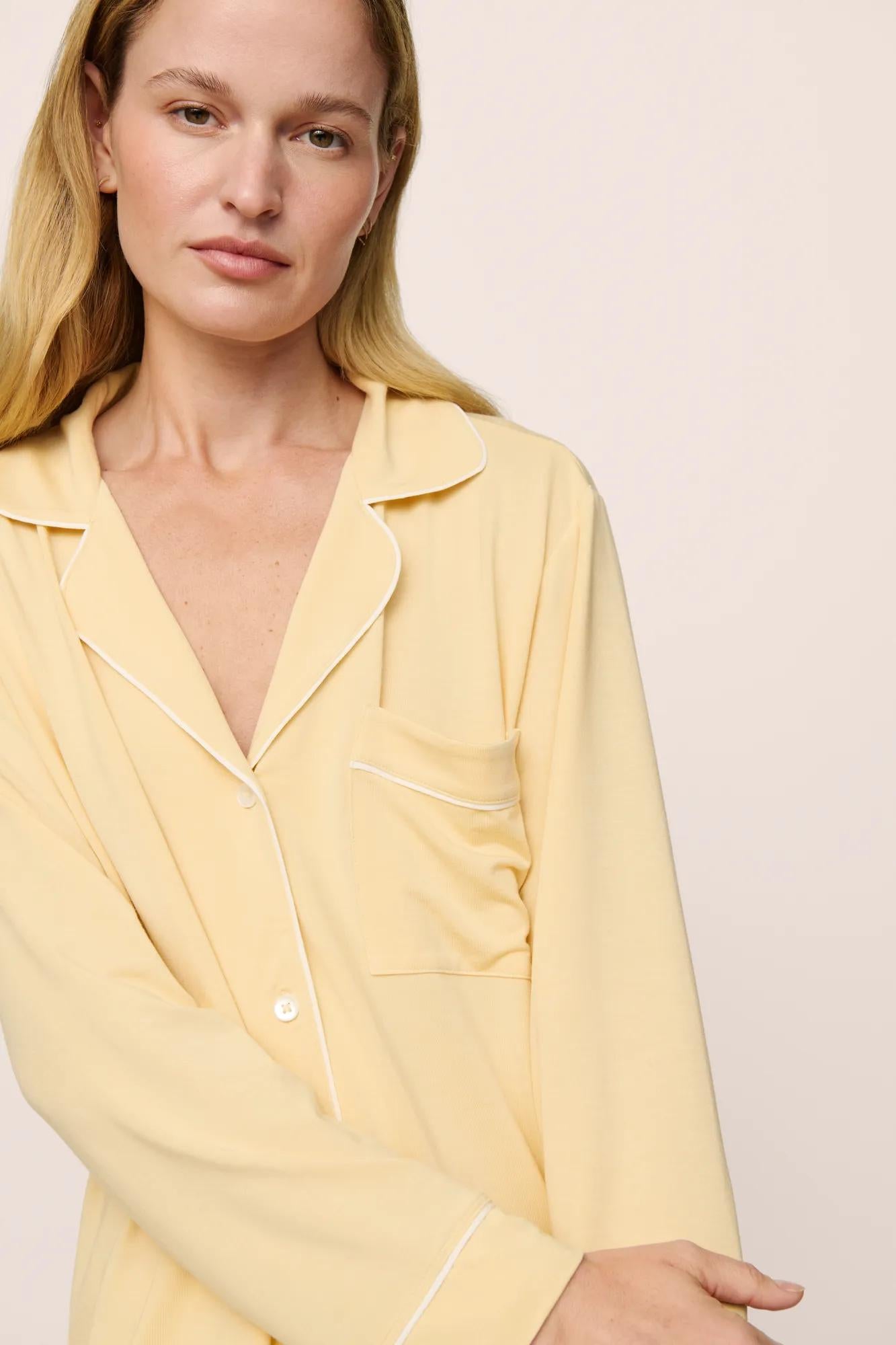 Model is wearing Gisele TENCEL™ Modal Long PJ Set in  Sunrise/Ivory