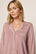 Model is wearing Gisele TENCEL™ Modal Long PJ Set in Woodrose/Ivory
