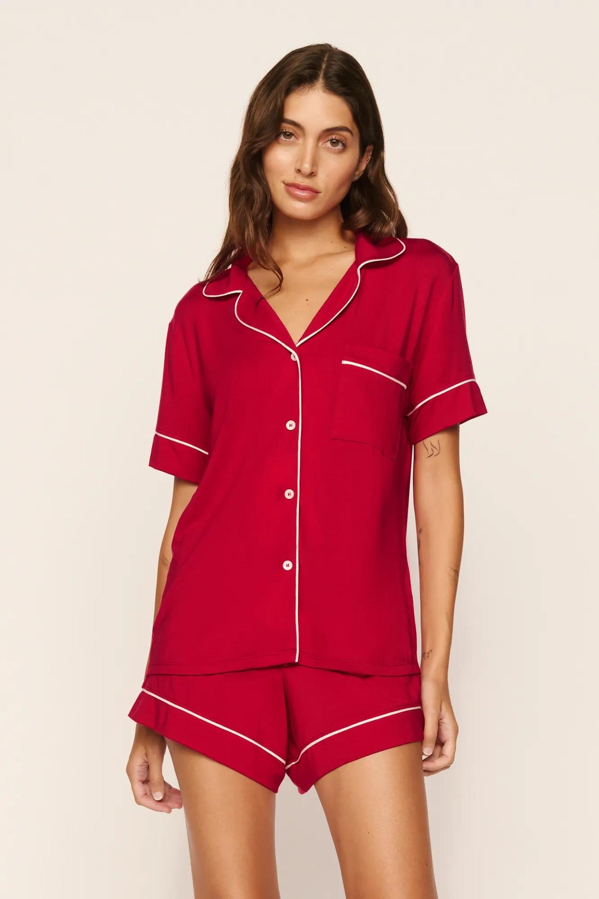 Model is wearing Gisele TENCEL™ Modal Relaxed Short PJ Set in Holly Red/Ivory