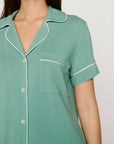 Model is wearing Gisele TENCEL™ Modal Relaxed Short PJ Set in Seagrass/White
