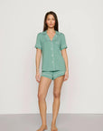 Model is wearing Gisele TENCEL™ Modal Relaxed Short PJ Set in Seagrass/White