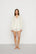 Model is wearing Gisele TENCEL™ Modal Long Sleeve Short PJ Set in Ivory/Navy