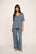Model is wearing Gisele TENCEL™ Modal Short Sleeve & Pant PJ Set in Moonlight Blue/Navy