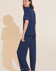 Model wears Gisele TENCEL™ Modal Short Sleeve & Pant PJ Set in navy/ivory.