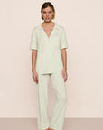 Model is wearing Gisele TENCEL™ Modal Short Sleeve & Pant PJ Set  in Seafoam/Ivory