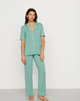Model is wearing Gisele TENCEL™ Modal Short Sleeve & Pant PJ Set in Seagrass/White