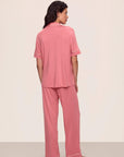 Model is wearing Gisele TENCEL™ Modal Short Sleeve & Pant PJ Set in  Sunkissed Coral/Ivory