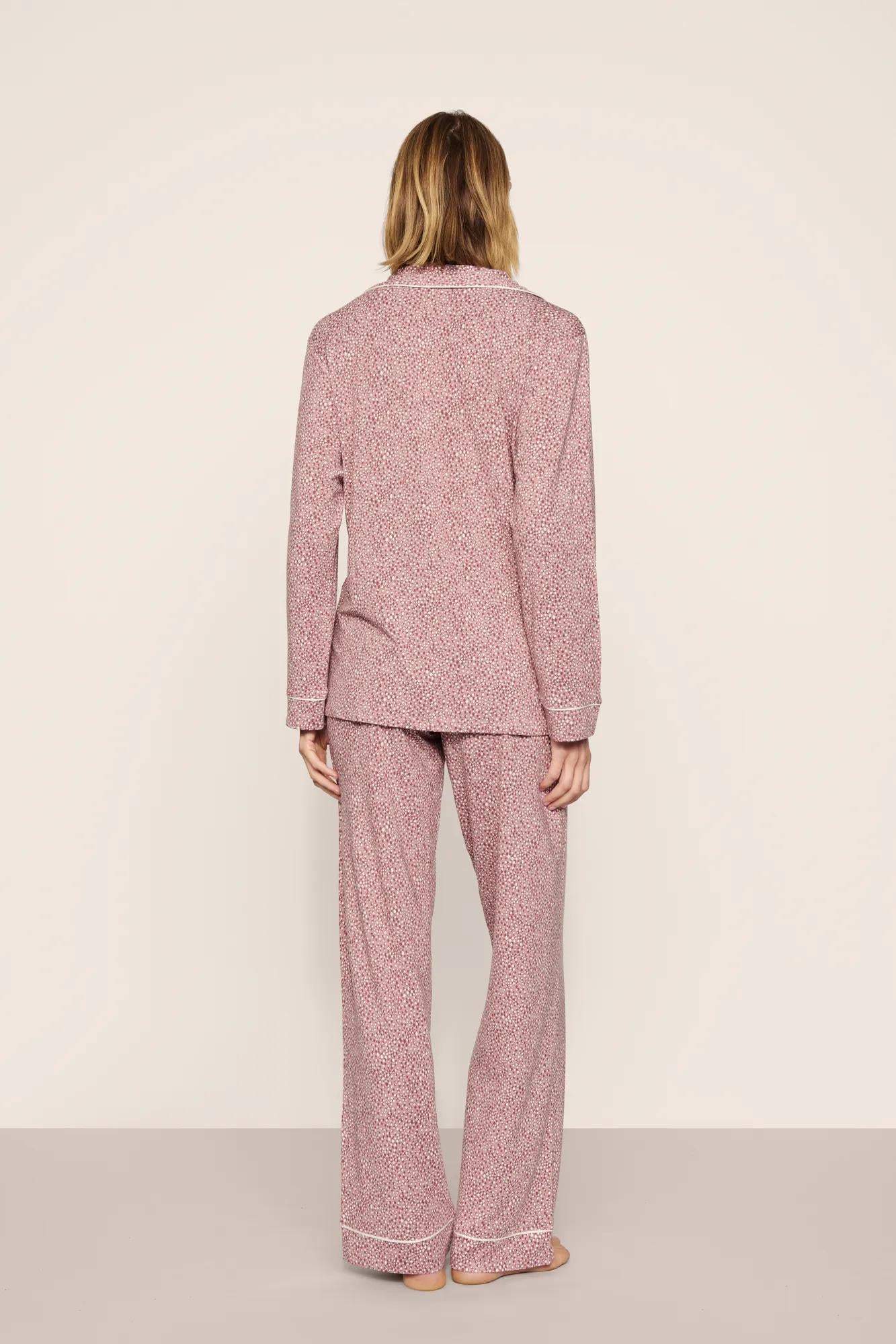 Model is wearing Gisele Printed TENCEL™ Modal Long PJ Set in Animal Instinct Woodrose/Ivory