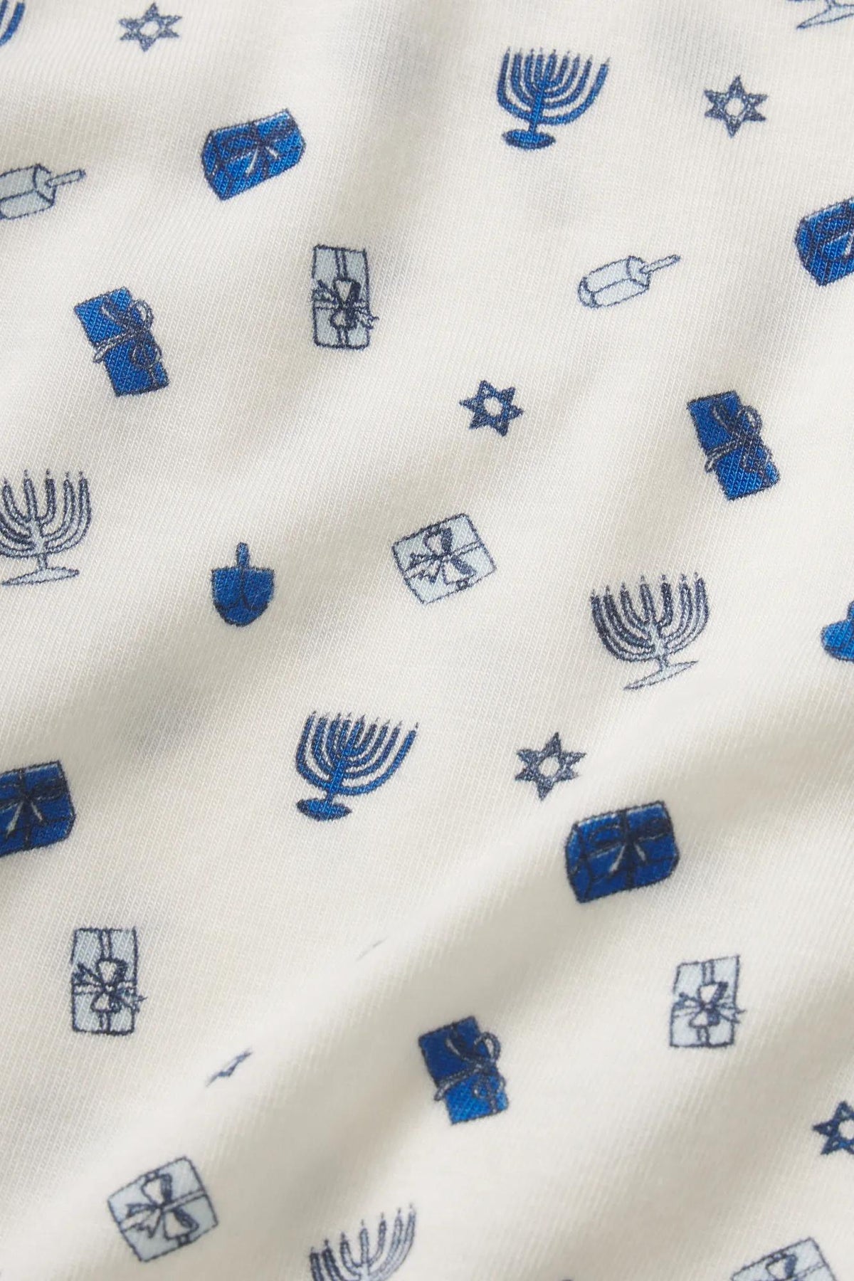 Model is wearing Gisele Printed TENCEL™ Modal Long PJ Set in Twinkling Menorah Ivory/Navy
