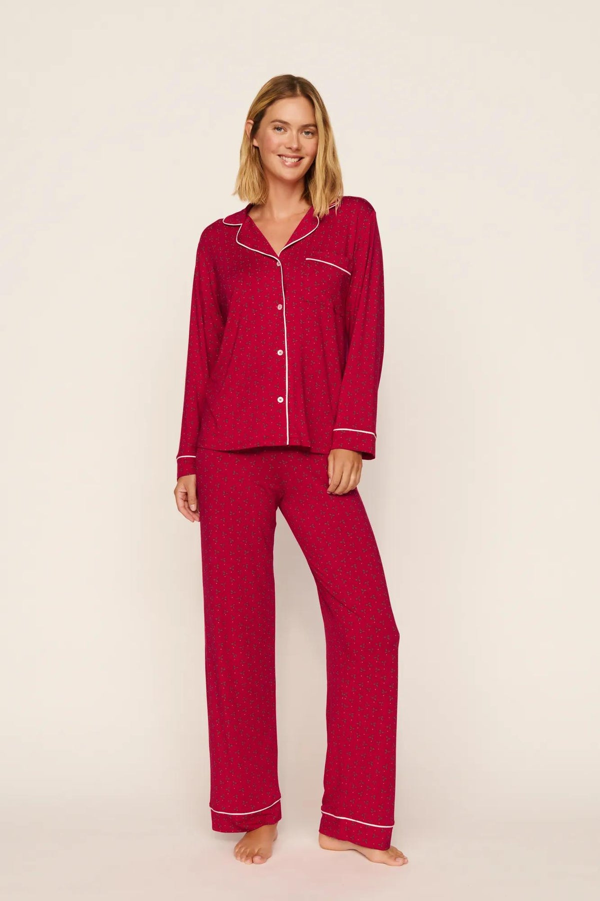 Model is wearing Gisele Printed TENCEL™ Modal Long PJ Set in Hollyberry Holly Red/Ivory