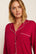 Model is wearing Gisele Printed TENCEL™ Modal Long PJ Set in Hollyberry Holly Red/Ivory