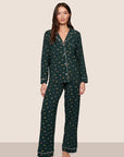 Model is wearing Gisele Printed TENCEL™ Modal Long PJ Set  in Holiday Dogs Pine/Ivory