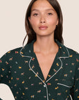 Model is wearing Gisele Printed TENCEL™ Modal Long PJ Set  in Holiday Dogs Pine/Ivory