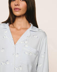 Model is wearing Gisele Printed TENCEL™ Modal Long PJ Set in Large Swans Ice Blue/Ivory