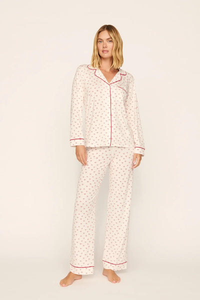 Model is wearing Gisele Printed TENCEL™ Modal Long PJ Set in Mini Bow Ivory/Holly Red