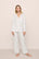 Model is wearing Gisele Printed TENCEL™ Modal Long PJ Set in SummerDaisyWhite/PaleMauve