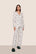 Model is wearing Gisele Printed TENCEL™ Modal Long PJ Set  in Ski Chalet Ivory/Pine