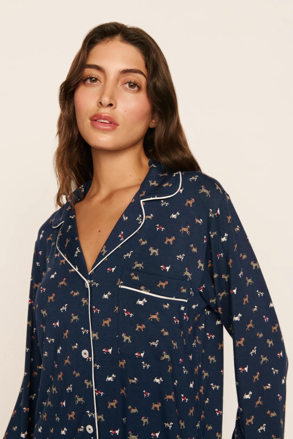 Model is wearing Gisele Printed TENCEL™ Modal Long PJ Set in Santa Paws Navy/Ivory