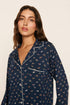 Model is wearing Gisele Printed TENCEL™ Modal Long PJ Set in Santa Paws Navy/Ivory