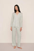 Model is wearing Gisele Printed TENCEL™ Modal Long PJ Set in Tide Dot Ivory/Ivory