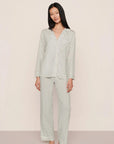 Model is wearing Gisele Printed TENCEL™ Modal Long PJ Set in Tide Dot Ivory/Ivory